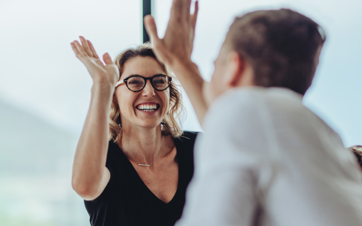 a man and a woman are happy with how easy it is in managing their employees super