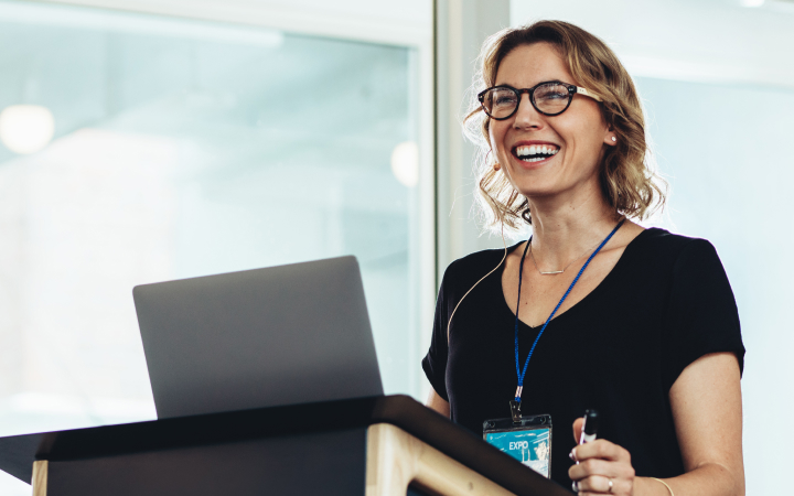 A female expert is happily giving super advice for employers and members