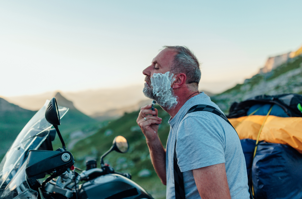 Man shaving on motorbike