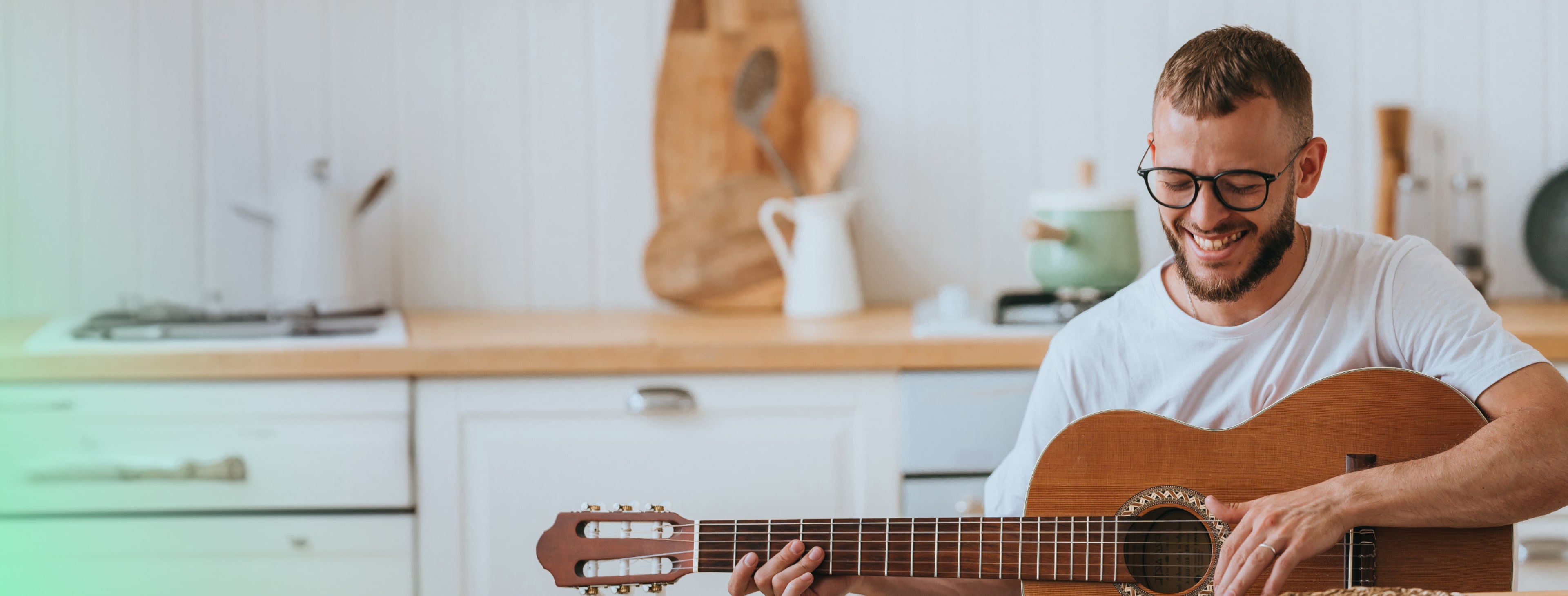 a man is playing guitar
