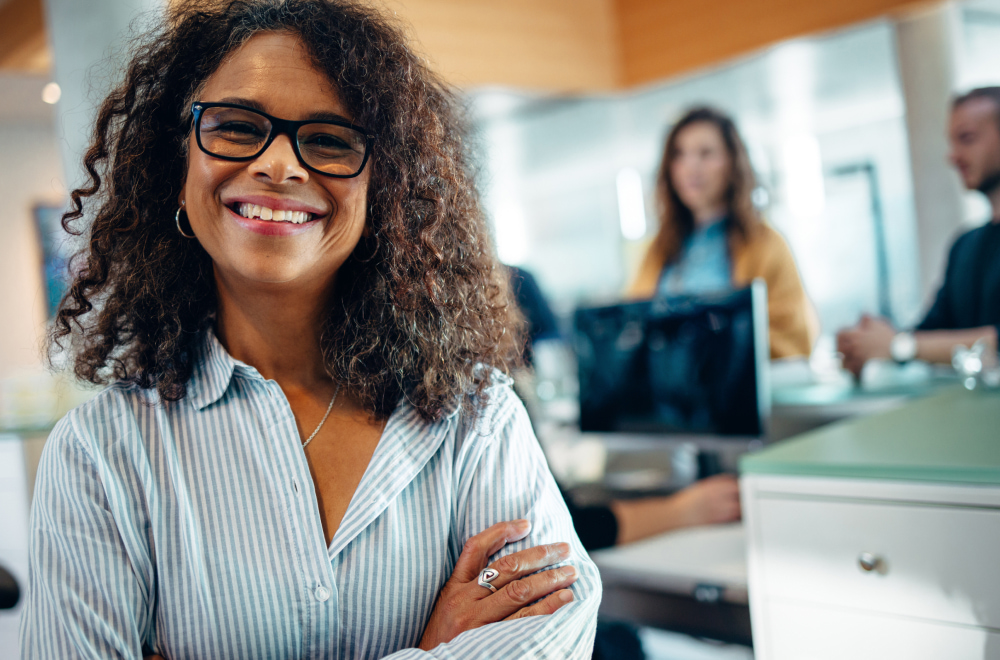 a happy woman in her office