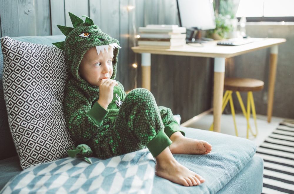 a young kid sitting on a couch