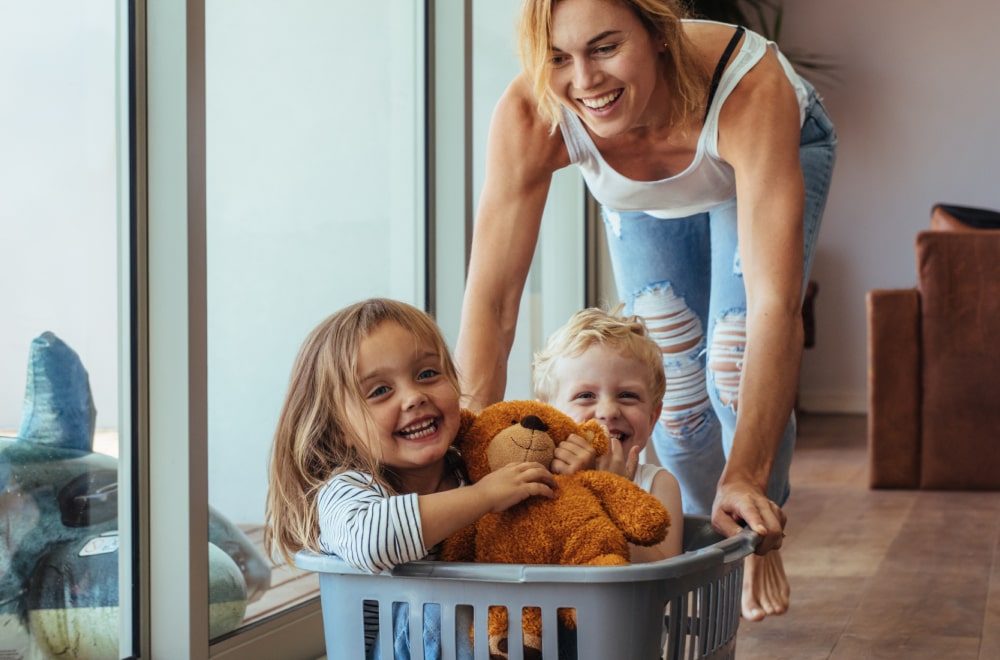 the mother is having fun with her two kids
