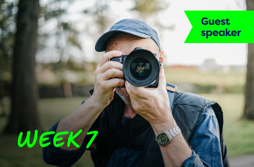 A man is taking photos of nature using his camera